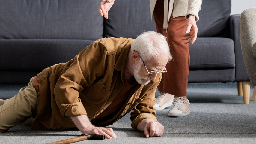 An elderly person who has fallen on the ground.
