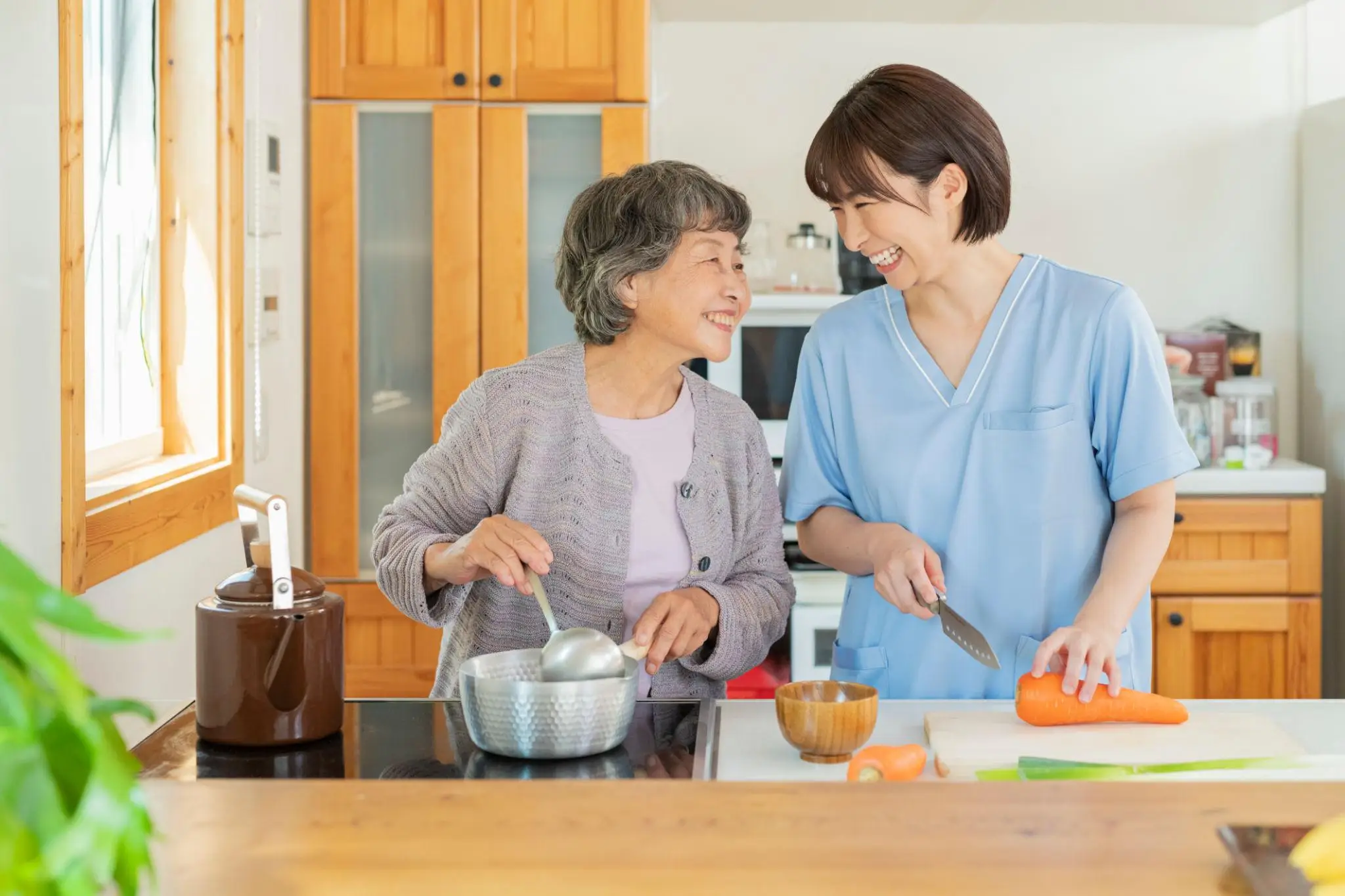 Caregiver helping a senior prepare a meal at home | Rose Hill Care