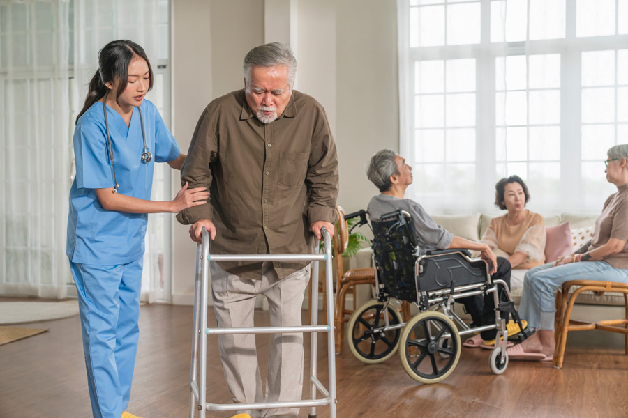 Care staff supporting a senior resident in an Ontario care facility. Rose Hill Care Mission